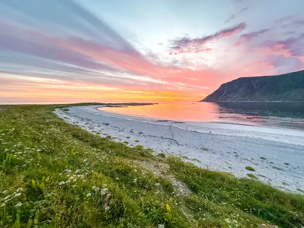View of colorful sunset, water ,mountains