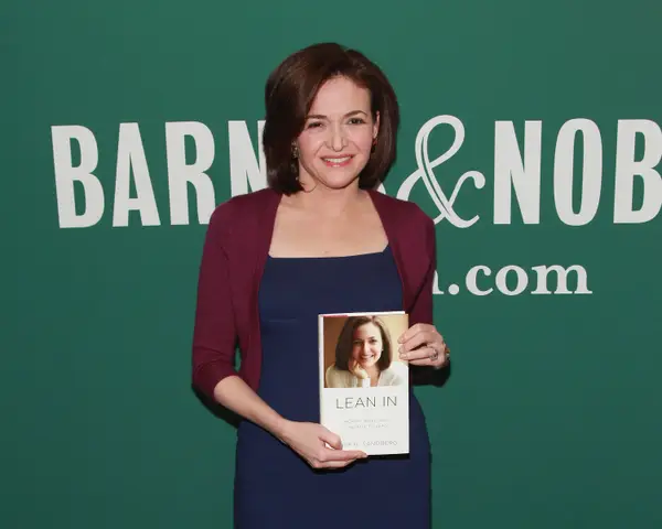 Sheryl Sandberg holding copy of "Lean In"
