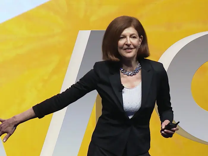 Pamela Meyer in front of yellow background